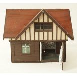 A 1940's painted dolls house, with the roof and side panels opening to reveal four rooms, 52.