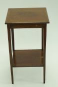 An Edwardian mahogany two tier occasional table, with satinwood and boxwood stringing, 69cm high,