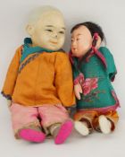 A 20th century Chinese opera doll with silk jacket and trousers, painted face and wooden head,