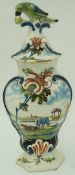 A late 18th century Dutch delft hexagonal vase and cover with bird finial,