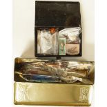A black Jappaned box containing lines and a tin of mainly vintage sea lures