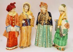 A collection of eight 20th century Greek ceramic figures of women,