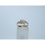 A two stone diamond 18ct gold crossover ring, the brilliant cuts, totalling approximately 0.