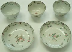 A pair of late 18th century Chinese famille rose tea bowls and saucers and a matching tea bowl