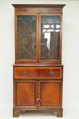 A mahogany secretaire bookcase with satinwood crossbanding,