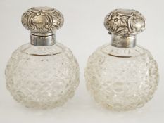 A pair of glass and silver mounted scent bottles, makers mark worn, Birmingham 1901,