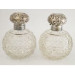 A pair of glass and silver mounted scent bottles, makers mark worn, Birmingham 1901,