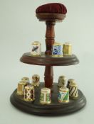 A set of fifteen Royal Crown bone china thimbles each decorated in coloured enamels and gilt,