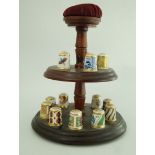 A set of fifteen Royal Crown bone china thimbles each decorated in coloured enamels and gilt,