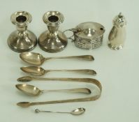 A pair of silver desk candlesticks; with a silver pierced mustard pot,