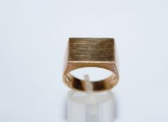 A 9 carat gold signet ring, of polished block design, finger size U,