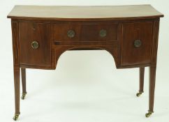 A 19th century mahogany and boxwood strung sideboard with a central drawer flanked by one deep