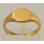 An 18 carat gold signet ring, the vacant octagonal head between engraved shoulders, finger size J,