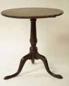 A 19th century George III style tilt top table with turned base on three cabriole legs, 68cm high,