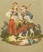 A Victorian Berlin wool work of a young couple feeding a goat, in a heavy gilt frame, 33cm high,