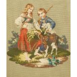 A Victorian Berlin wool work of a young couple feeding a goat, in a heavy gilt frame, 33cm high,