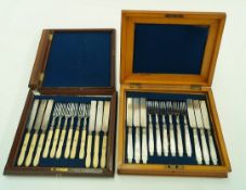 A set of twelve mother of pearl handled dessert knives and forks in satin walnut case with mother