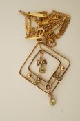An Edwardian peridot and seed pearl pendant, stamped '9ct', of square outline,