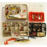 A box of assorted vintage and modern lures