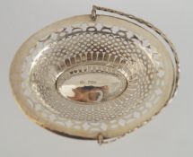 A late Victorian silver swing handled bon bon basket, London 1900, of pierced oval design, 13.