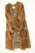 A mink ladies fur coat, by Furriers Epsom, 23395, with deep turned cuffs and collar,