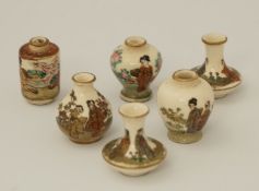 A pair of early 20th century period miniature Japanese earthenware  vases,