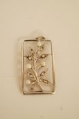 A rose cut diamond and pearl pendant, of foliate design within a rectangular frame,