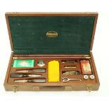 A Parker-Hale gun cleaning kit, in mahogany case, 46.