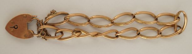 A 9 carat gold bracelet, of elongated curb links, to a padlock clasp with safety chain, 18cm long,