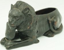 A Bretby pottery commemorative figure of a lion,