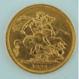 An 1877 full sovereign, Victoria young head,