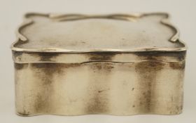 A silver jewellery casket, by A & J Zimmerman, BIrmingham 1907, of rectangular serpentine outline,