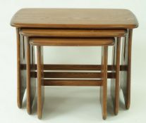 An Ercol oak nest of three tables with impressed metal makers mark, 45cm high, 63cm wide,