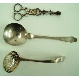 A pair of George III silver sugar nips with shell terminals,