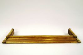 A late 19th / early 20th century brass fender in Art Nouveau style, 122cm long,