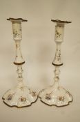 A pair of 18th century Staffordshire enamel candlesticks,
