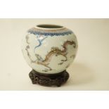 A 19th century Chinese bowl decorated in underglaze colours with two dragons and bats,