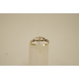 A three stone diamond ring, the single cuts illusion set, finger size K1/2, 1.