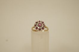 A ruby and cubic zirconia cluster 9 ct gold ring, finger size K, 2.