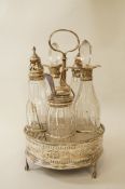A Georgian silver cruet stand with five silver mounted bottles, marks worn,