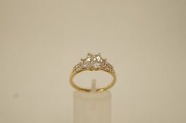 A 9 ct gold cubic zirconia dress ring, finger size T, 3.