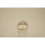 A 9 ct gold cubic zirconia dress ring, finger size T, 3.