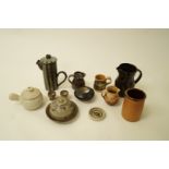 A Winchcombe pottery jug with slip glaze, 10.5cm high, a Winchcombe brown glazed jug, 19.