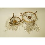 Two early 20th century brass chandeliers,