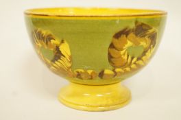 A Mocha ware worm pattern bowl on a green and yellow ground, impressed 3, 8cm high, 11.