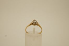 A diamond single stone 9 ct gold ring, the brilliant cut of approximately 0.