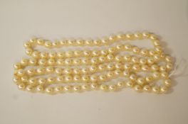 A row of uniform cultured pearls, the 111 pearls of approximately 7-7.
