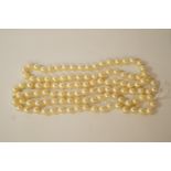 A row of uniform cultured pearls, the 111 pearls of approximately 7-7.