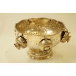 A silver plated punch bowl and six matching cups, each with half reeded decoration,