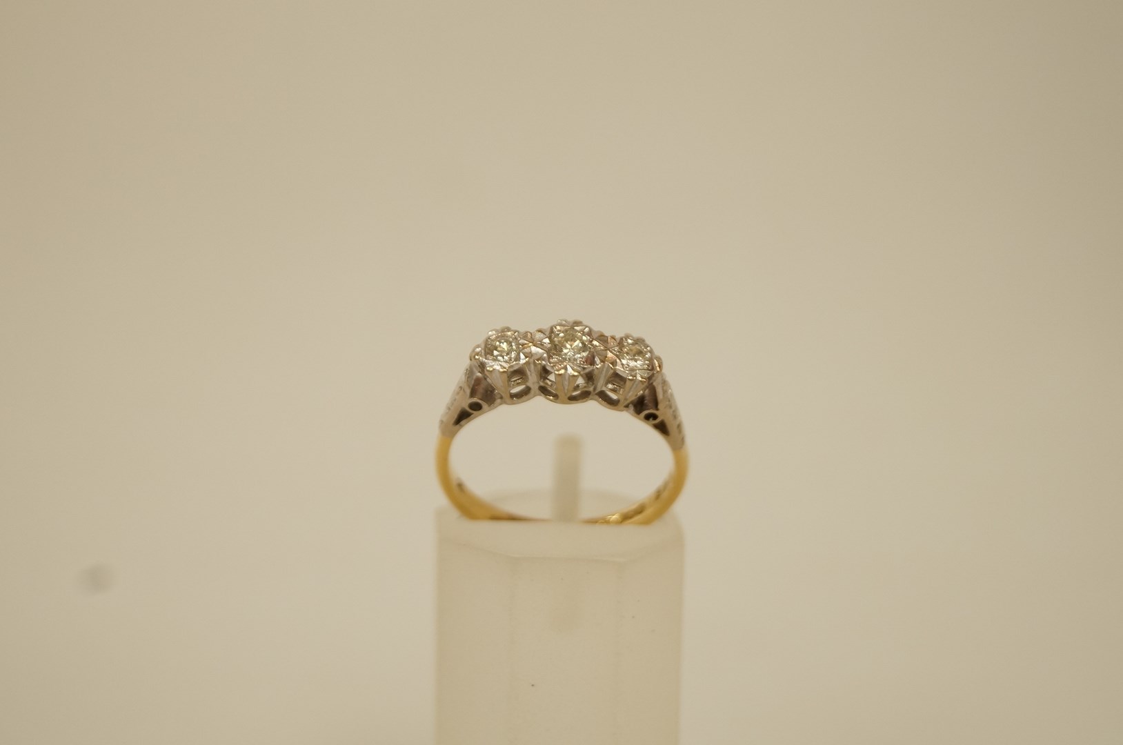 A three stone diamond 18 ct gold ring,